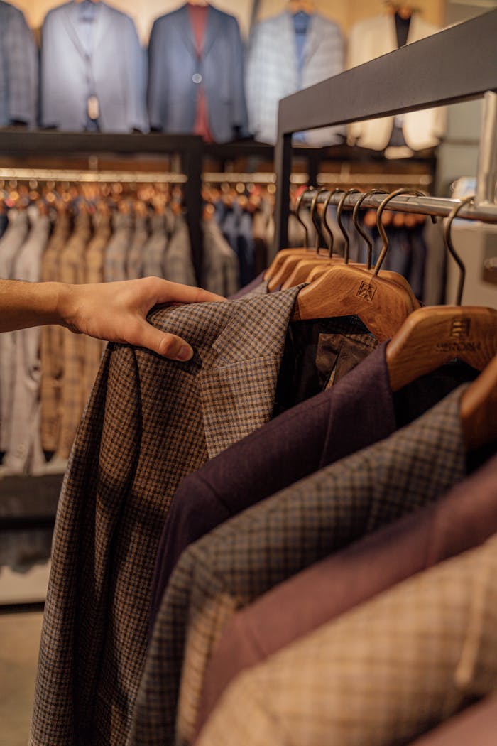 Close-up of elegant mens jackets on display in a modern boutique. Perfect for autumn fashion.